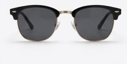 Sunglasses with black lenses and gold frames on a white background