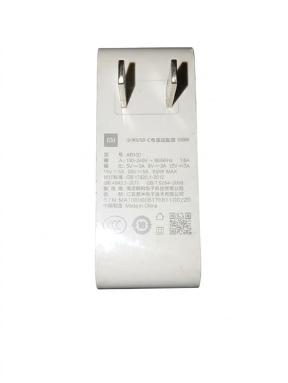 A white Xiaomi USB-C power adapter with Chinese specifications printed on the front, photographed against a plain white background.