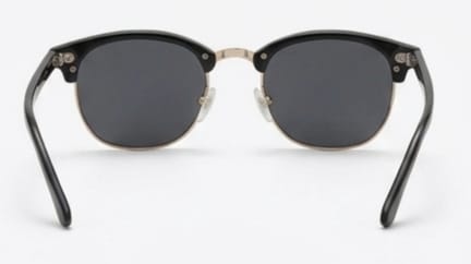 Black sunglasses with gold accents on a white background