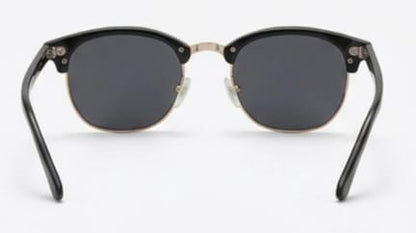 Black sunglasses with gold accents on a white background