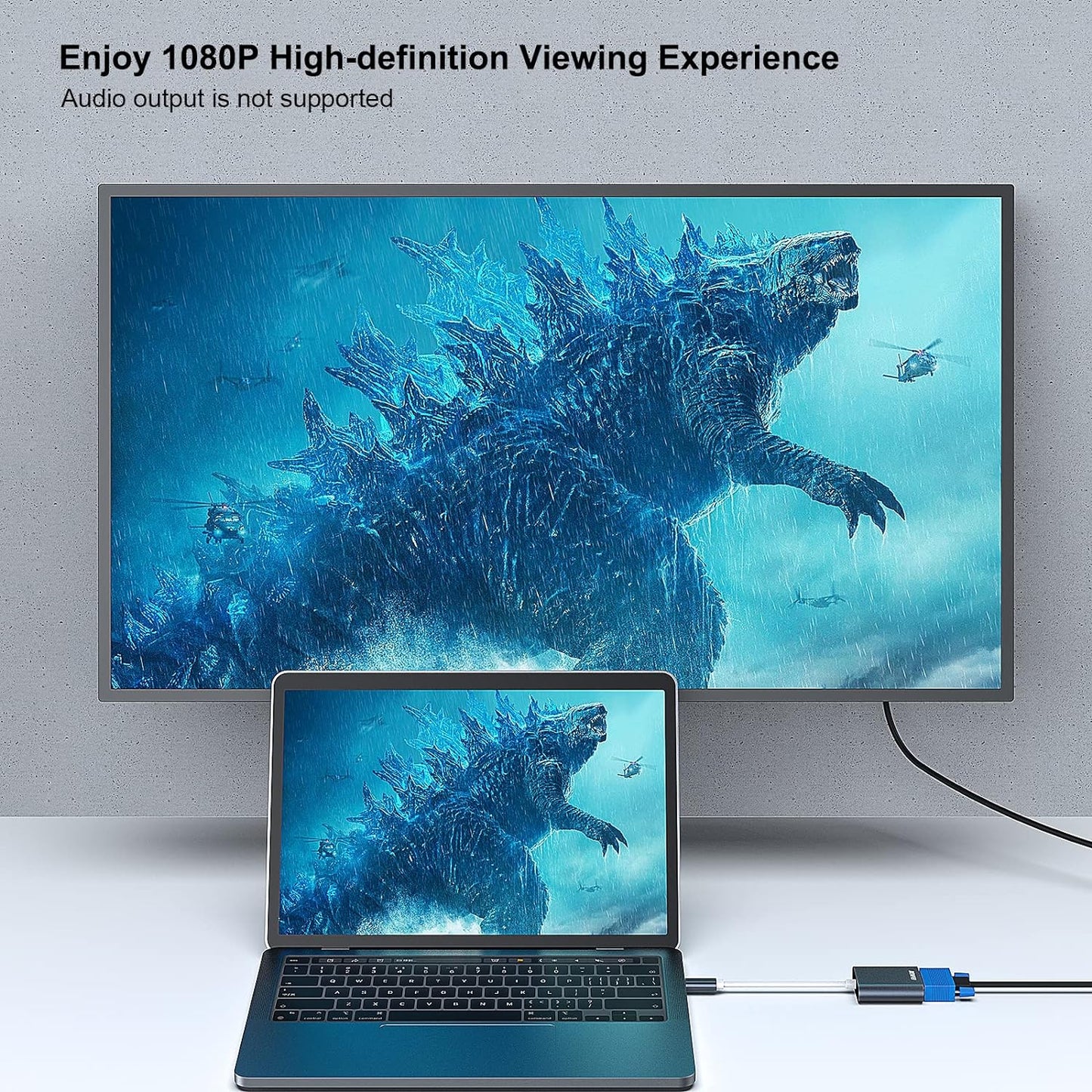 TV and laptop displaying , connected by a cable.