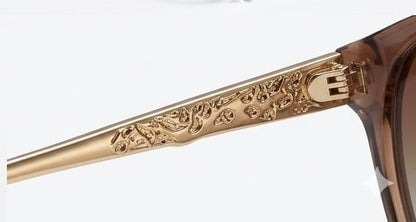 Valentino Sunglasses in Pakistan – Gold‑Framed Sunglasses with Intricate Design on a White Background