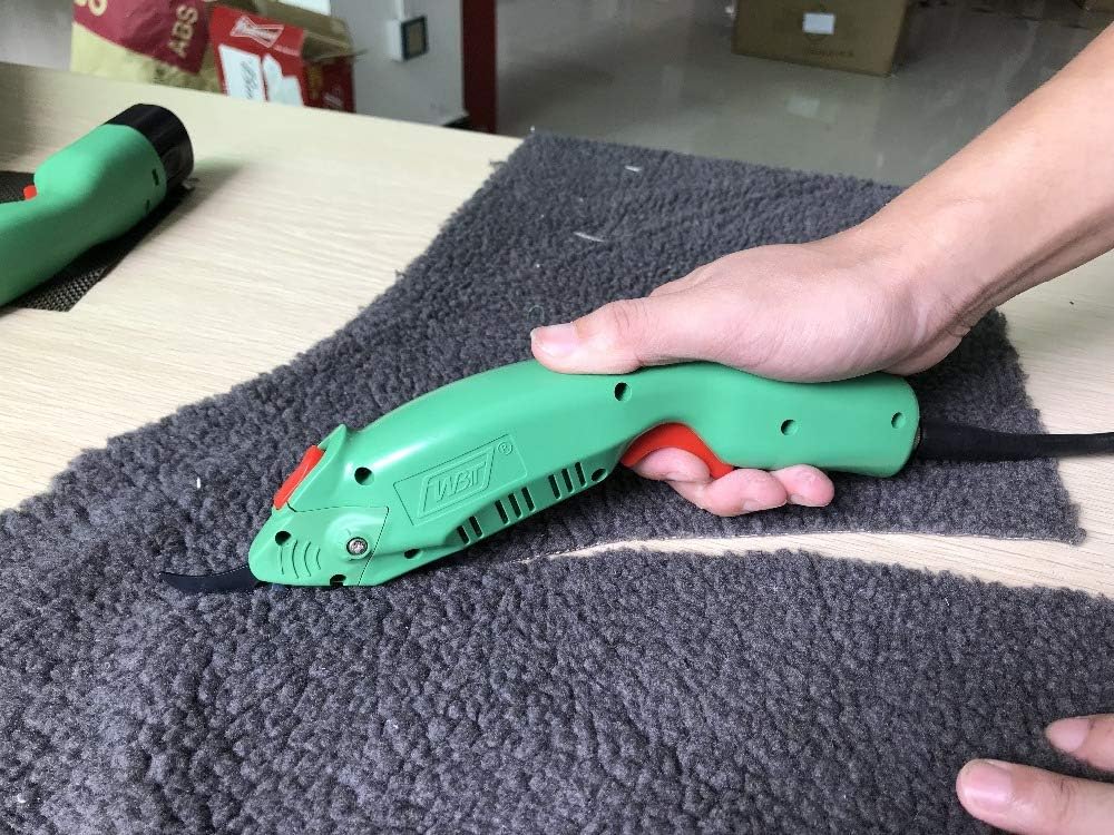 WBT-2 cordless electric scissors cutting UHMWPE UD fabric, aramid, and carbon fiber materials