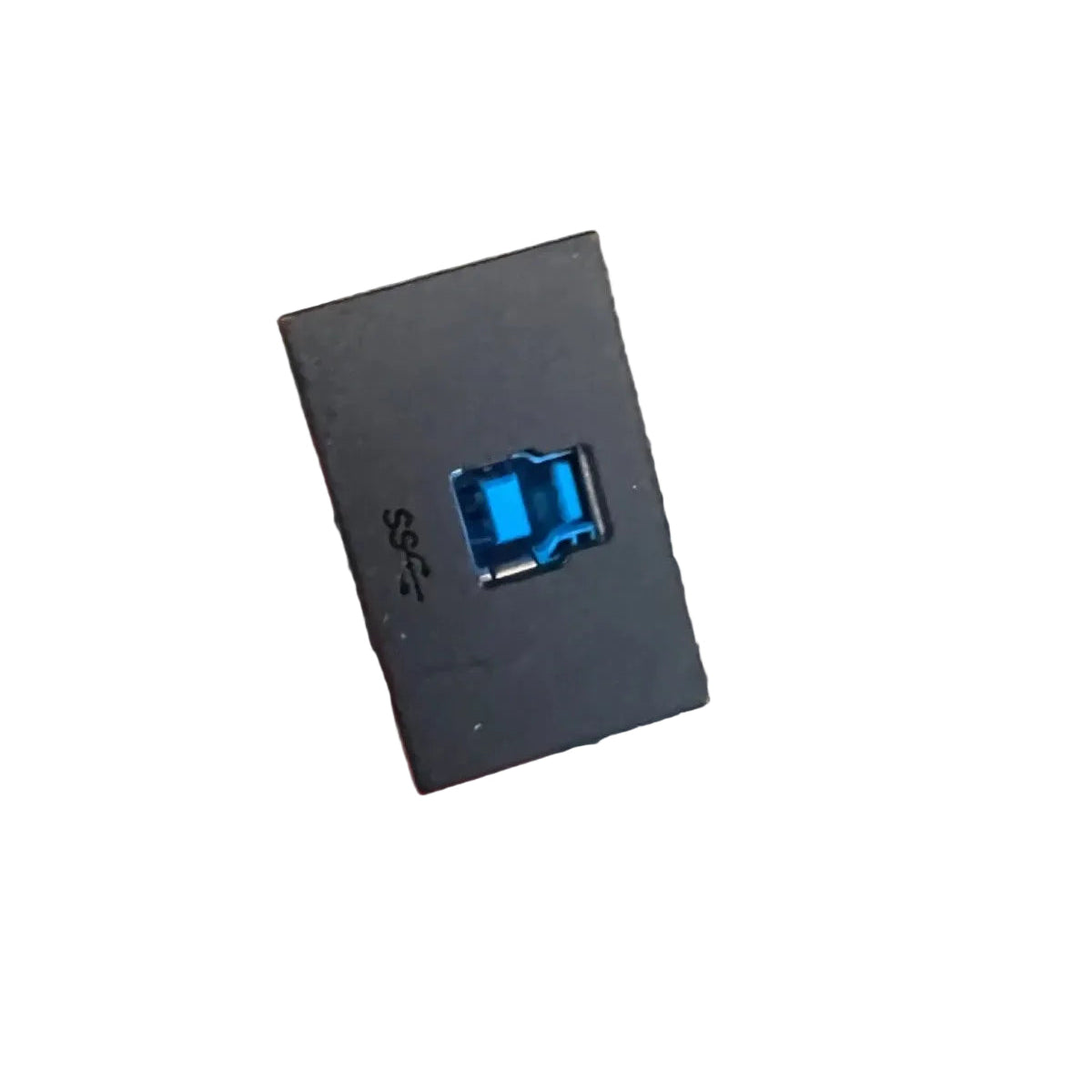 A hand holding a small black rectangular electronic component with a blue USB-A connector, with a coiled black cable in a clear plastic bag below it, set against a gray carpeted background.