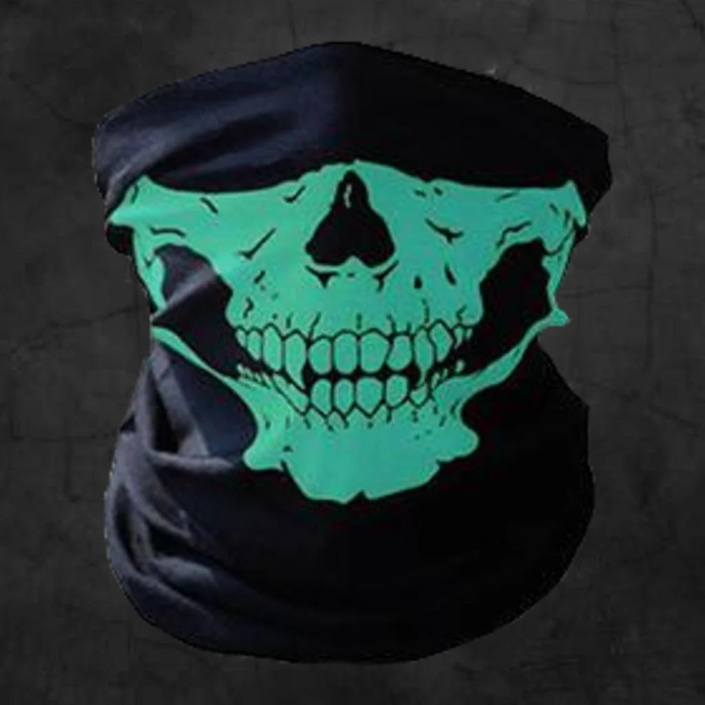 Glowing green skull design on a black face mask, bike riding mask Pakistan, against a dark background